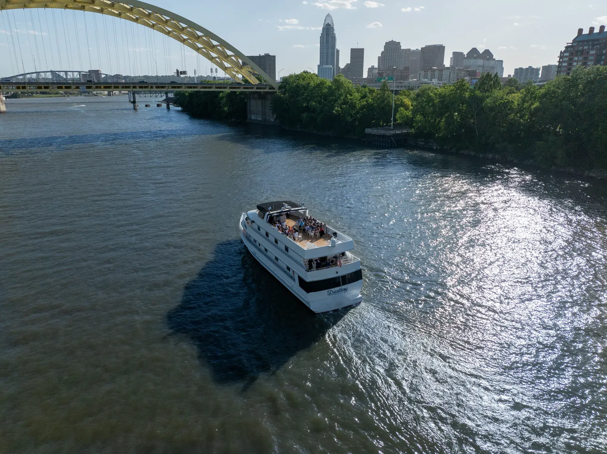 The Destiny, Cincinnati's only charter yacht, cruising past the Big Mac Bridge and downtown skyline