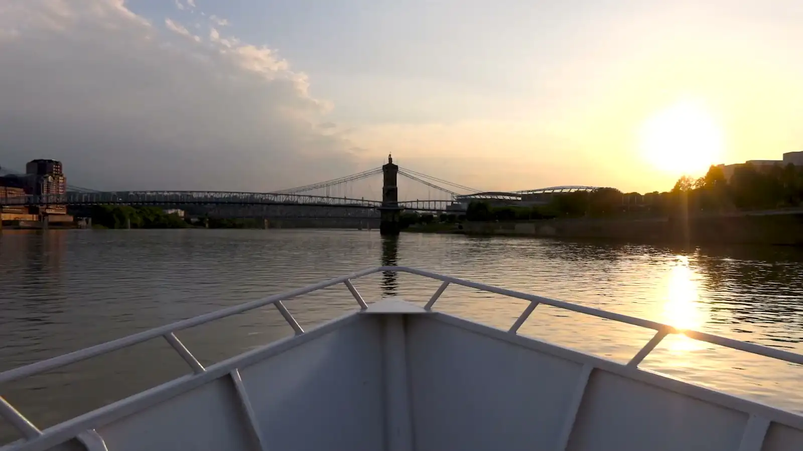 The Destiny yacht cruising the Ohio River at golden hour